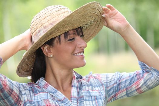 Woman wearing straw hat