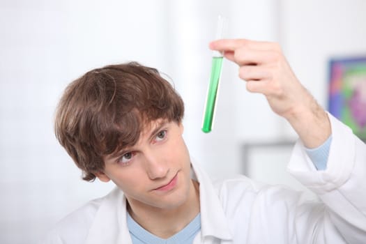 Male teenager in science laboratory
