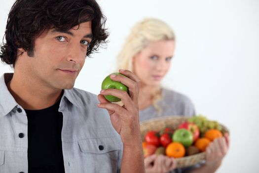 Couple with fruit basket
