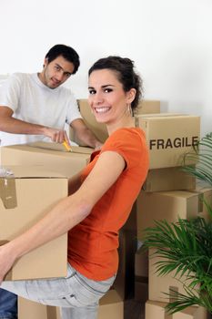 Couple unpacking their belongings