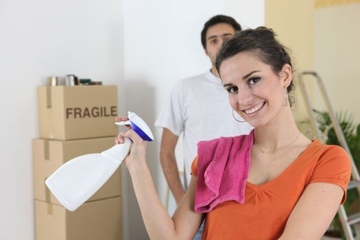 Couple cleaning house