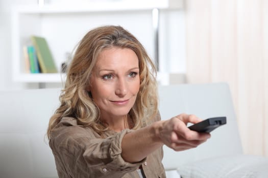portrait of a woman with remote control