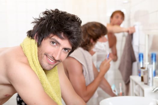 Handsome young man getting ready with his mates