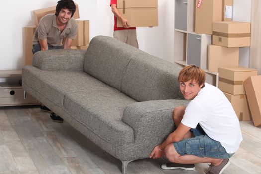 Men lifting sofa