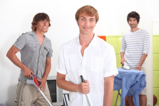 Three lads doing their chores