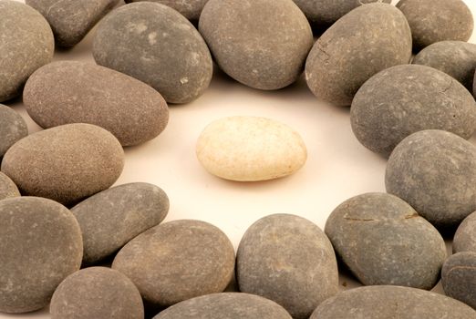 Closup of white stone surrounded by grey stones