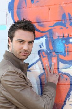 Man stood by wall