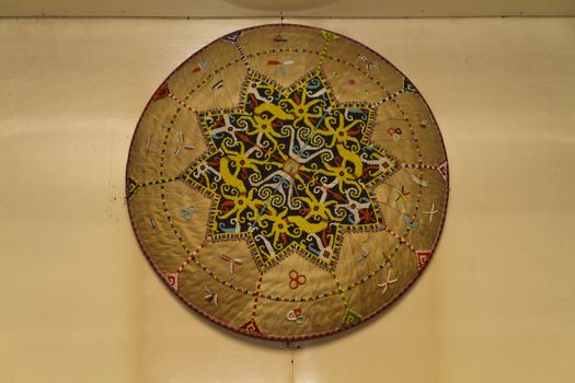 A Sarawak beadcrraft on display on the wall of long house