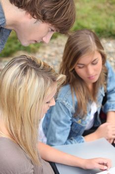 Teenagers sat outside