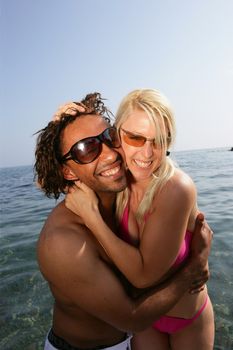 Cheerful couple in the sea