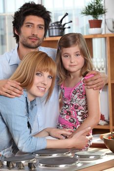 Parents and their daughter in the kitchen