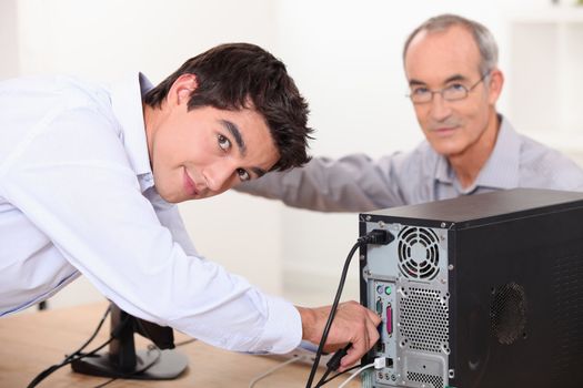 Technician repairing computer