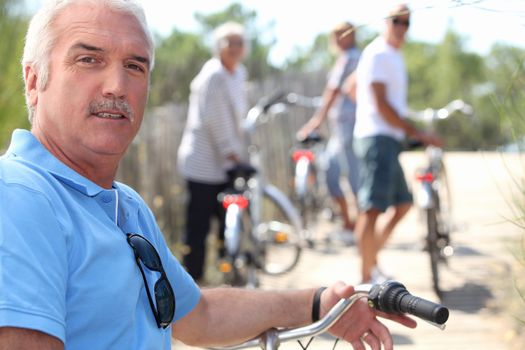 portrait of a man on a bike