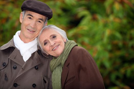 A mature couple in a park.