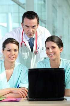 doctor and two nurses in a hospital