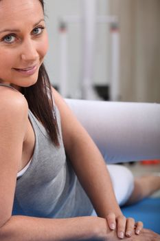 Woman exercising on a mat