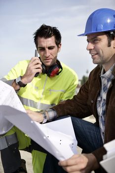 Site engineers with a walky talky