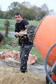 craftsmen making cement