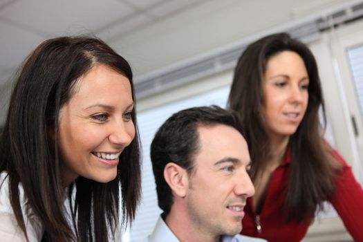 Headshot of three colleagues at work