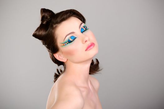 young beautiful woman makeup studio shot
