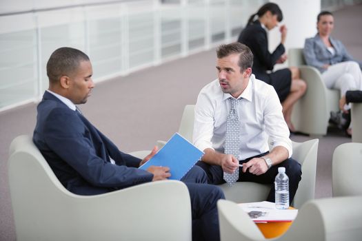 Businessmen chatting