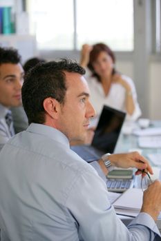 Attentive workers in business meeting