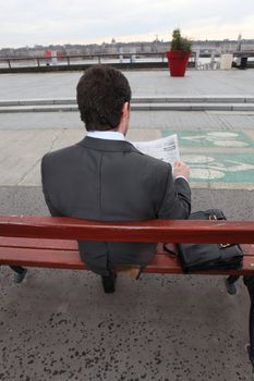 man sitting on a bank