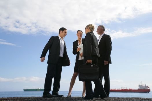 A team of businesspeople meeting on the quay
