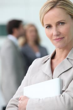 businesswoman holding a laptop