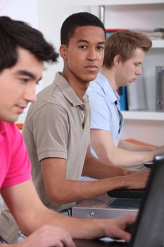 Three students in the library.