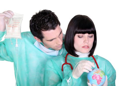 Two doctors with globe