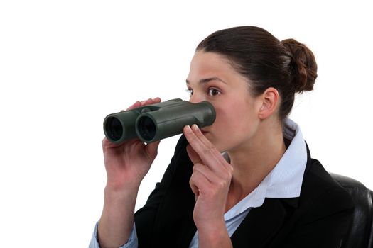 Office worker with a pair of binoculars