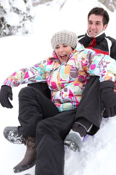 Couple on a sledge