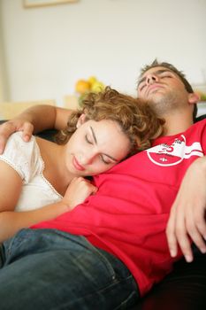 couple sleeping on the couch