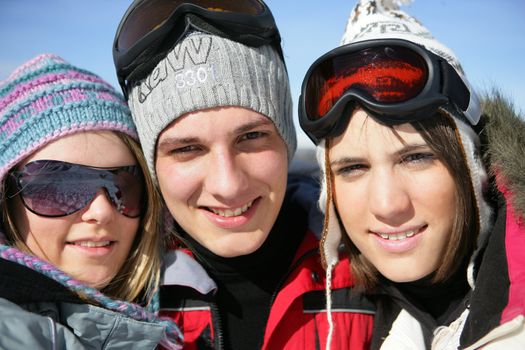 three teenagers on a ski vacation