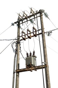 Electric transformer substation against a blue sky with white clouds