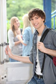 teenage boy leaving high school