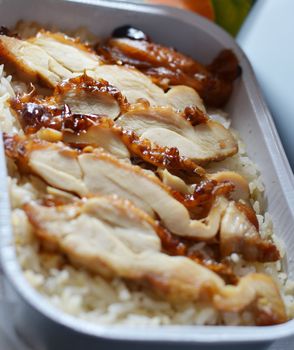 a delicious grilled chicken on steamed rice