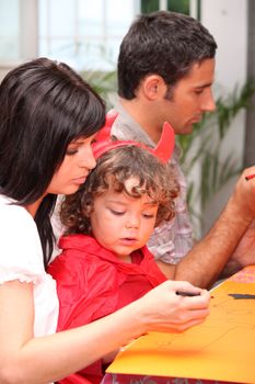 family preparing fancy-dress ball