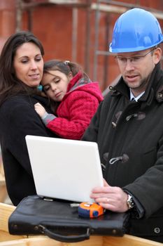 Architect on location with a young family