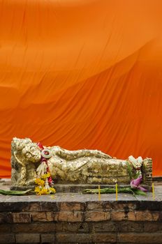 reclining buddha statue with gold leaf in thailand