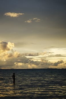 tropical sunset with tourist woman