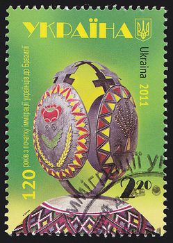 UKRAINE - CIRCA 2011: A post stamp printed in Ukraine shows symbolic globe and trees, with inscription "Europa вЂ“ International Year of Forests 2011", circa 2011.