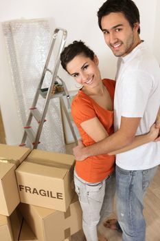 Couple with boxes marked fragile