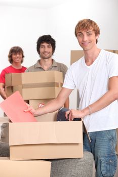 Three men moving house