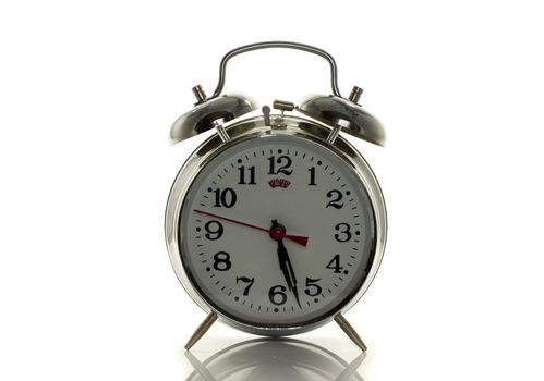 metal clock on isolated white