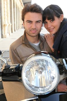 Young couple on a scooter