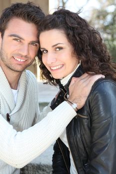 Young couple smiling outdoors