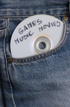 DVD with games, music and movies in pocket of the jeans