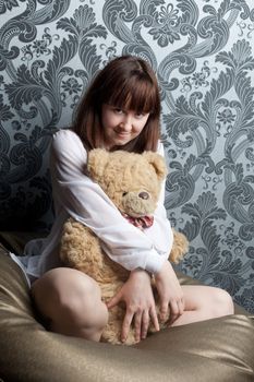 A girl and a big soft toy
